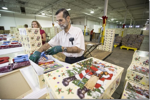 Toronto’s Fred Mirza Volunteers  On 74th birthday making Santa Claus Fund boxes